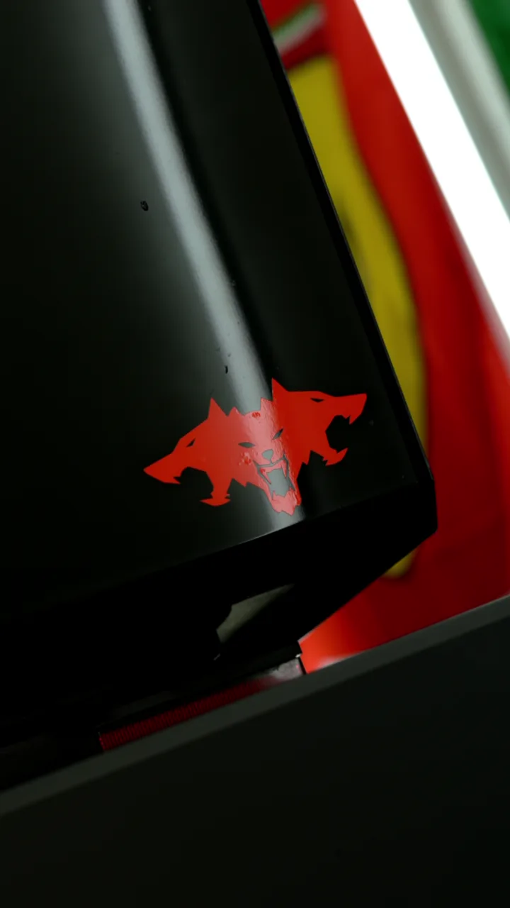 Custom red wolf graphic on a gloss black Cybertruck